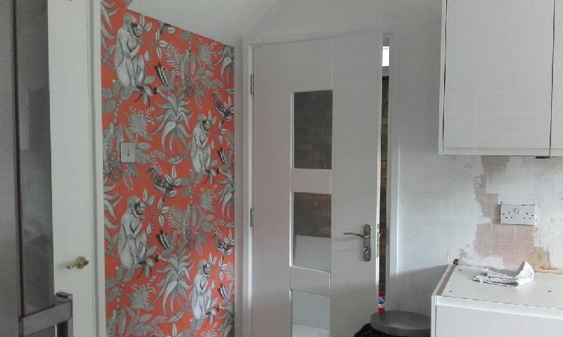 stunning wall paper. Makes a huge difference to the room. brings style