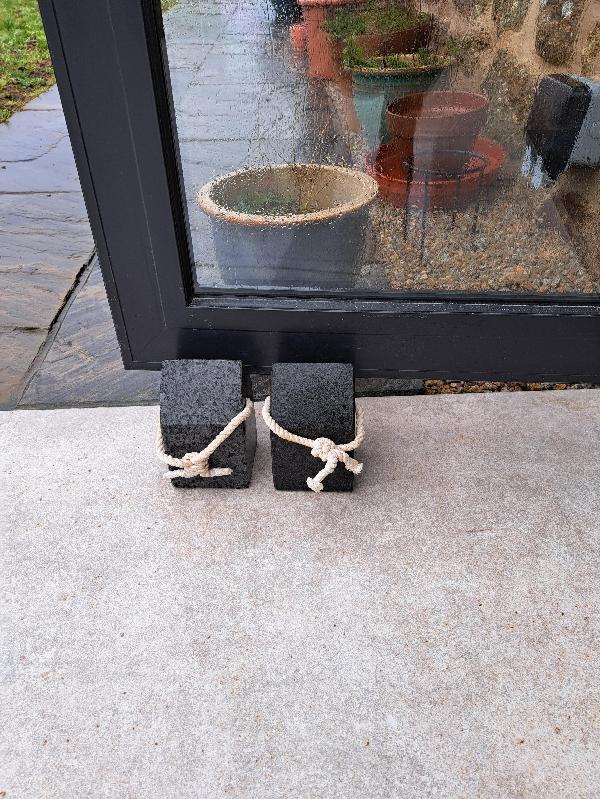 Small heavy outdoor doorstop.