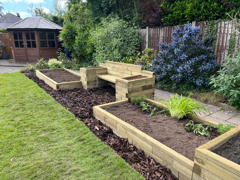 A very clever way to build raised flower beds