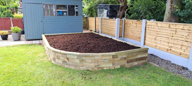 Raised bed designed to fit corner area